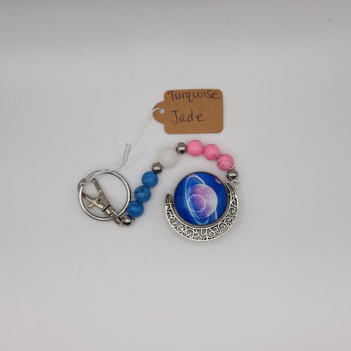 Pink and blue turquoise and white jade with saturn key-chain *glows in the dark*