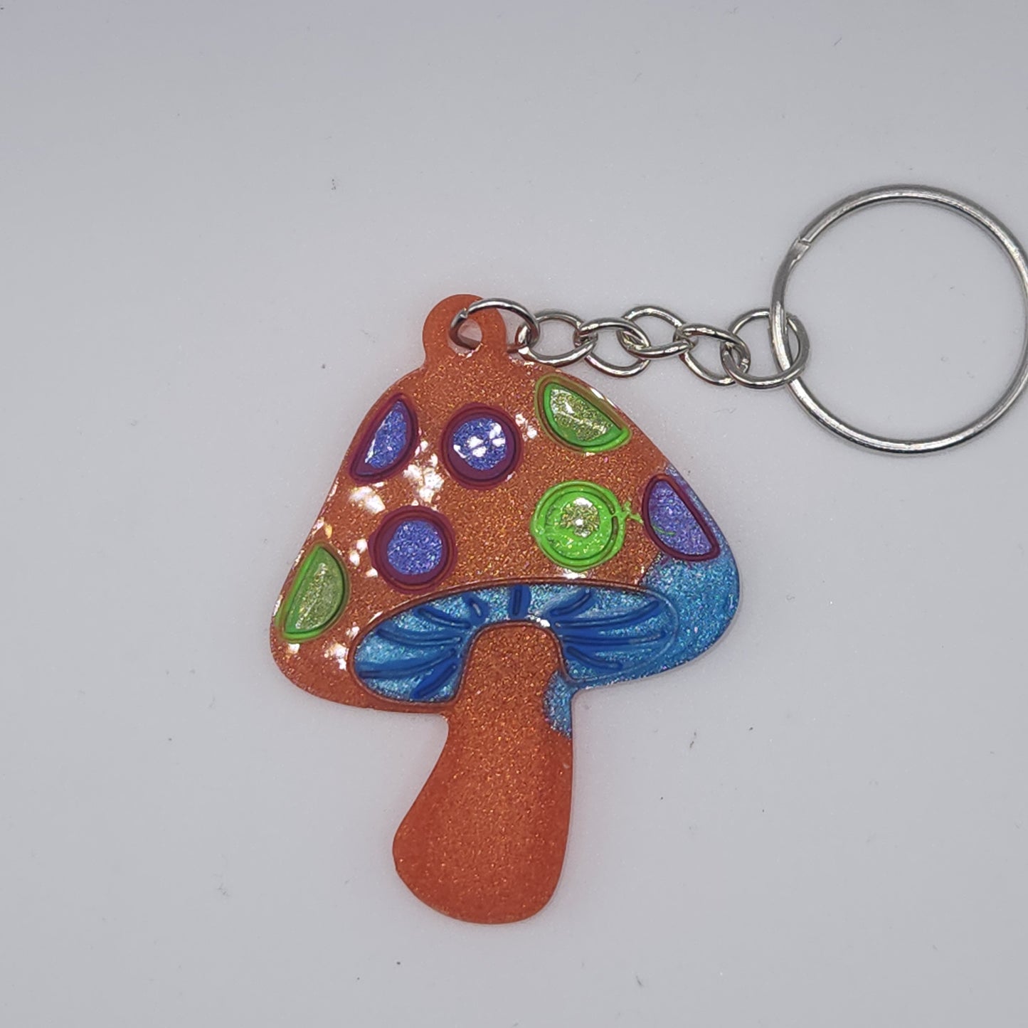 Orange with purple and green mushroom key-chain *Glows in blacklight/UV*