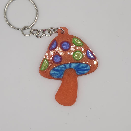 Orange with purple and green mushroom key-chain *Glows in blacklight/UV*