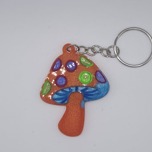 Orange with purple and green mushroom key-chain *Glows in blacklight/UV*