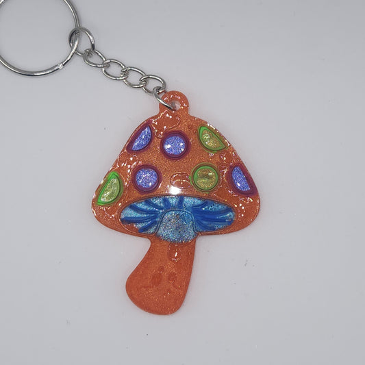 Orange with purple and green mushroom key-chain *Glows in blacklight/UV*